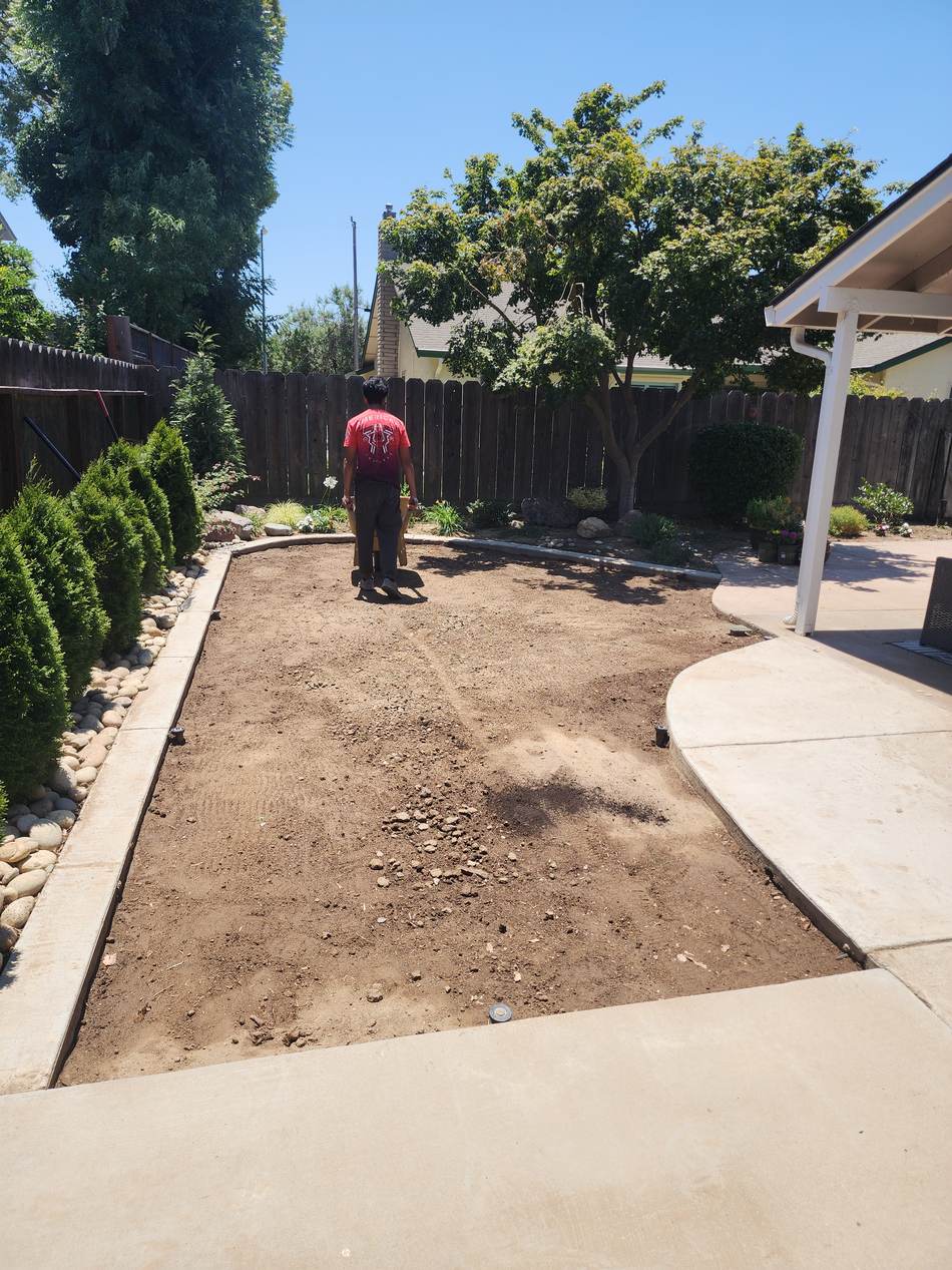 Bare backyard before sod installation in Escalon